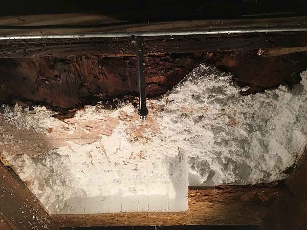 A white powder on a wood surface used for pest control